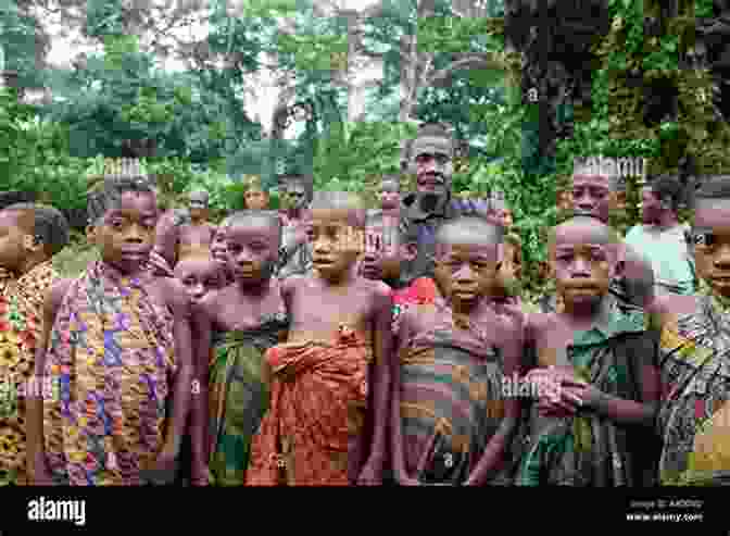 A Gebusi Family Poses For A Portrait In Their Traditional Rainforest Village. The Gebusi: Lives Transformed In A Rainforest World