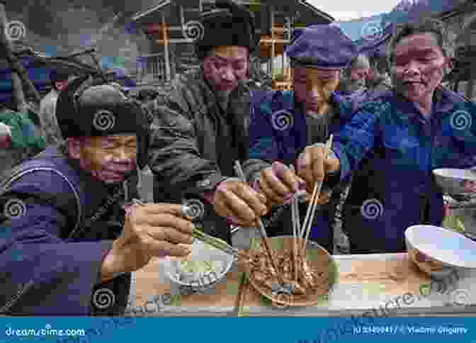 A Group Of Travelers Sharing A Meal With Local Villagers, Fostering Intercultural Exchange Get Real Get Gone: How To Become A Modern Sea Gypsy And Sail Away Forever