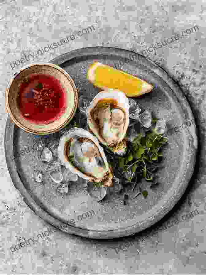 A Plate Of Freshly Shucked Oysters With Lemon Wedges The Pacific Northwest Seafood Cookbook: Salmon Crab Oysters And More